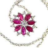 An 18 Carat White Gold Diamond And Ruby pendant With Chain.