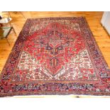 An Antique Heris Persian Carpet. 330 cm x 246 cm.