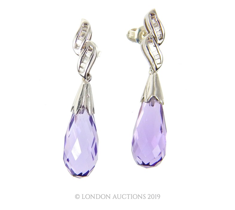 A Pair Of White Gold Diamond And Amethyst Drop Earrings.