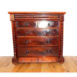 A Victorian Mohagany Chest Of Drawers.