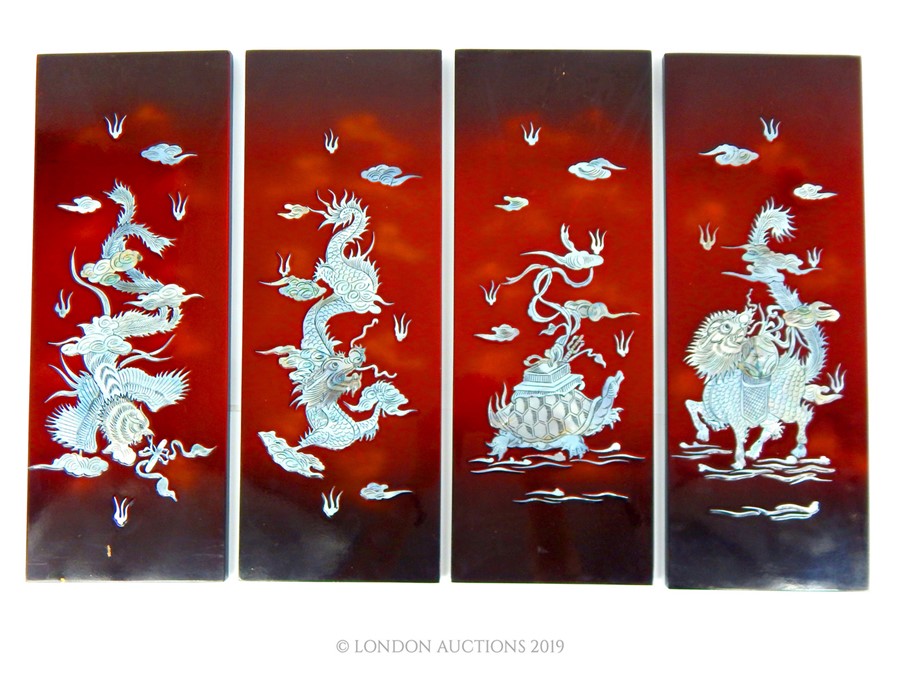 Four Oriental Lacquered Wall Hangings.