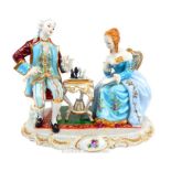 A large Meissen Diorama Of A Couple Playing Chess.