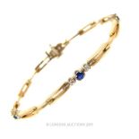 A 14 Carat Yellow And White Gold Sapphire And Diamond Bracelet.