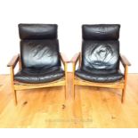 A Pair of Vintage Leather And Bent Wood Reclining Chairs.