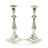 A Pair Of Sterling Silver Single-Stemmed Candlesticks