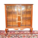 A MAHOGANY WITH GLAZED DOOR DISPLAY CABINET.