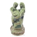 An Abstract Green Glazed Terracotta Sculpture Depicting A Family With Child