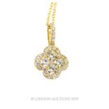 An 18 carat yellow gold Diamond set pendant necklace in the form of a four leaf clover 70 points