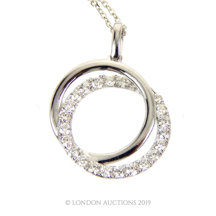 An 18 Carat White Gold Diamond Pendant Necklace.