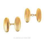 A Vintage 9 Carat Gold Oval Patterned Cuff-links.
