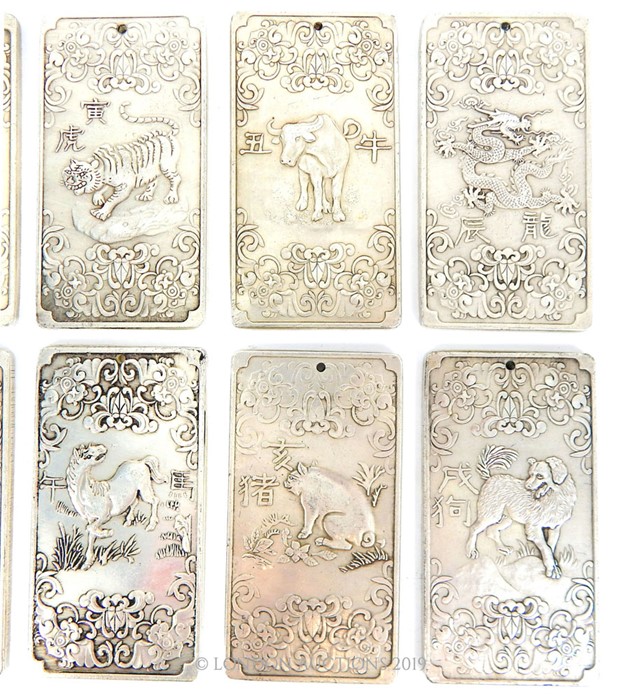 A Set of Twelve White Metal Year Symbols. - Image 4 of 5