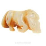 A Chinese Ming Dynasty Jade Sculpture Depicting A Kneeling Horse