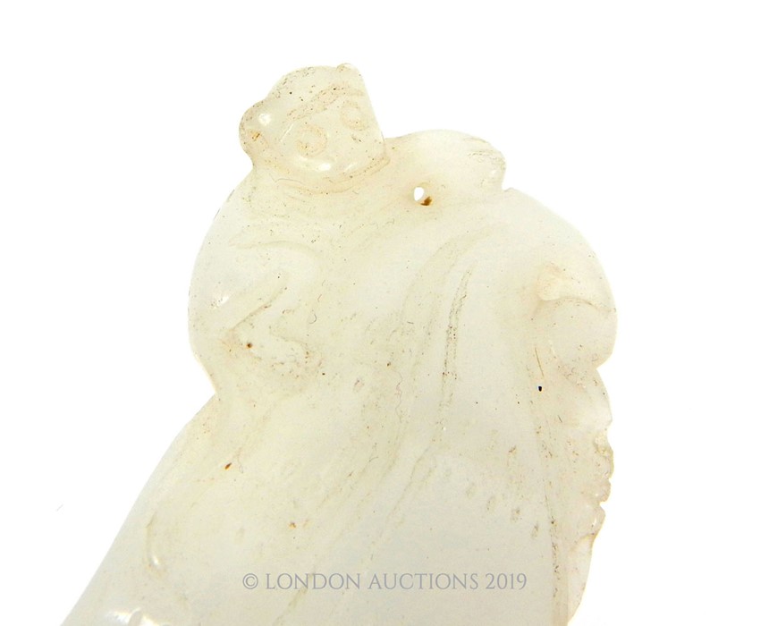 A Mid Qing Dynasty White Jade Monkey And Fruit Hanging Decoration - Image 2 of 3