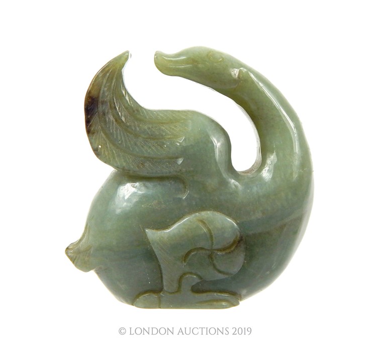 A Chinese Late Qing Period Green Jade Sculpture Of A Mythical Bird