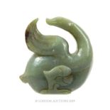 A Chinese Late Qing Period Green Jade Sculpture Of A Mythical Bird
