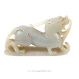 A Chinese Qing Period Pale Jade Statuette Of A Mythical Dragon