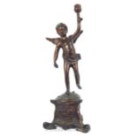 A Bronze Figure Of Winged Cherub Holding Torch Candle Holder.