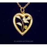 An Edwardian 9 Carat Gold Pearl And Peridot Heart pendant.