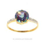 A 9 Carat Gold Mystic Topaz And Diamond Ring.