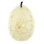 A Chinese Qing Period Celadon Jade Pendant Depicting A Meditating Buddha