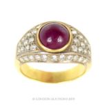 A Thick Banded Yellow Metal/Gold Ring With 42 Rough Cut Diamonds And A Large Round Cut Ruby