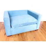 An Upholstered Blue Oversized Arm Chair.