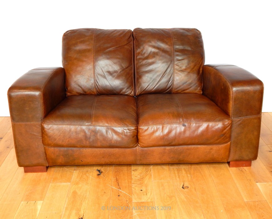 A Twin Seater Sofa in Brown Leather.