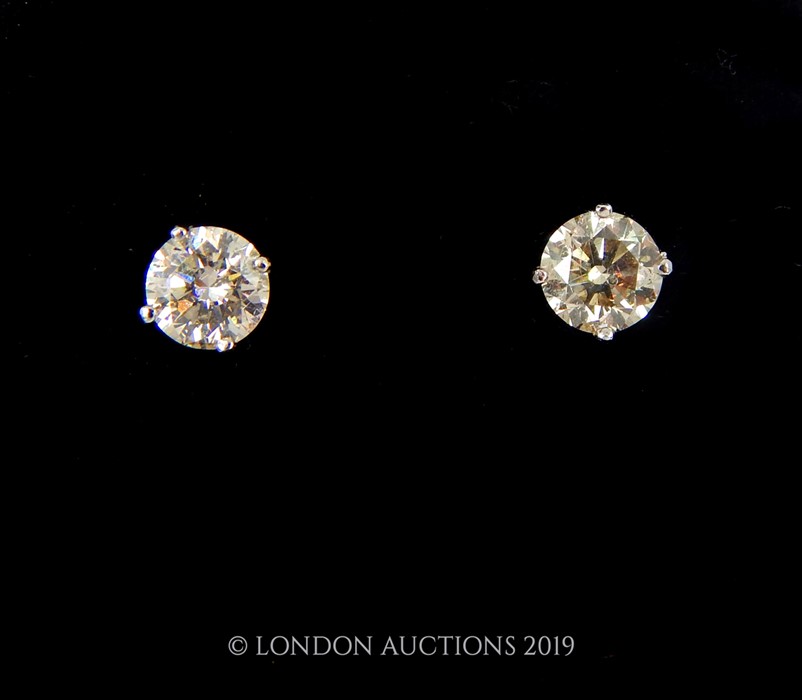 A Pair of White gold Diamond Stud Earrings.