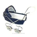 A Child's Play Pram in the Style of Silver Cross.