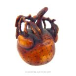 A Small Chinese Hardwood Snuff Bottle in the Form of a Mangosteen.