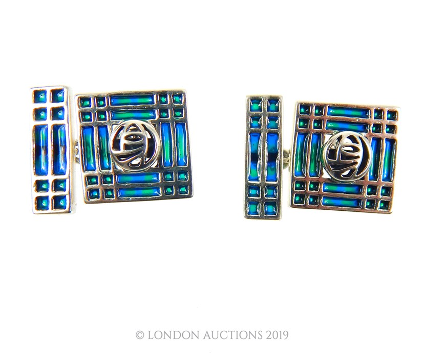 A Pair Of Silver And Enamel Tiffany Style Cuff-Links.