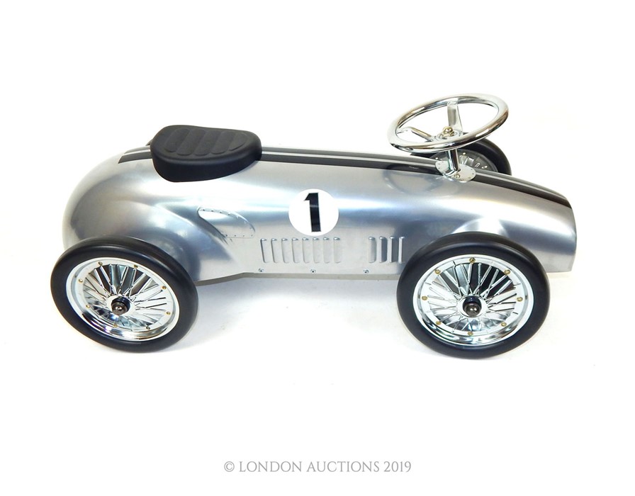 A Silver Metal Ride-On Number 1 Retro Sports Car