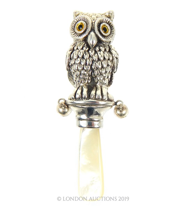 A Silver Owl Shaped Babies Rattle.