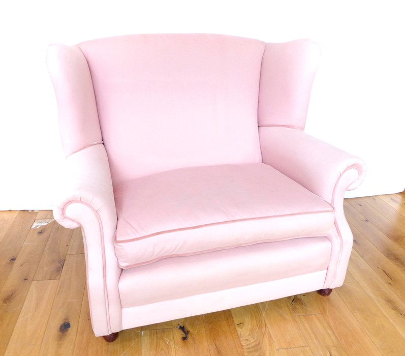 A Contemporary Pink Oversize Wingback Chair.
