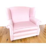 A Contemporary Pink Oversize Wingback Chair.