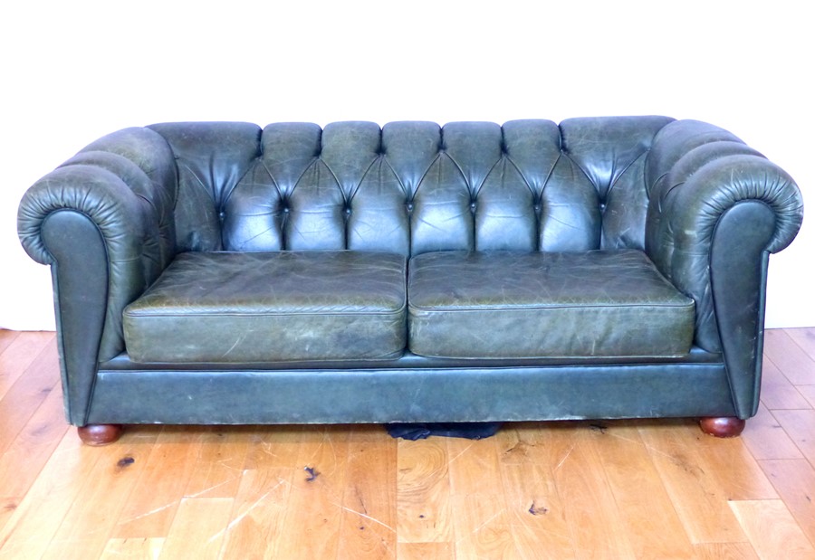 A Green leather Chesterfield Sofa.