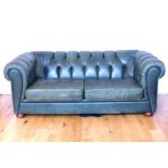 A Green leather Chesterfield Sofa.