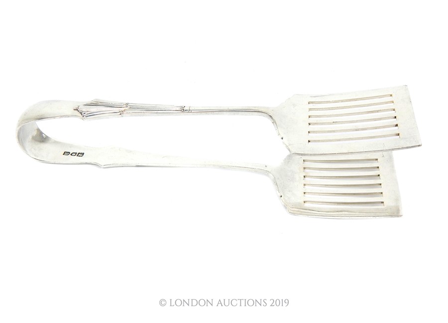 An Edwardian Sterling Silver Albany Set Of Sardine Tongs by William Hutton And Sons