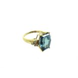 a 9 Carat Madagascan Blue/Green Paraiba Apatite And Diamond Ring.