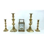 Four Brass Candlesticks And A Carriage Clock