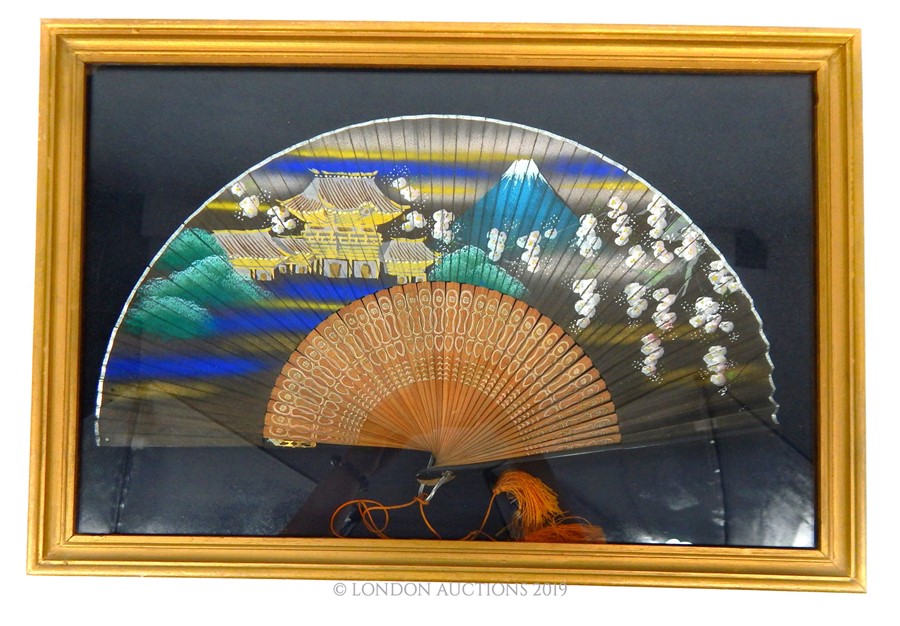 A Framed Japanese Fan.