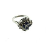 A Large 18ct White Gold Stepped Cluster Ring With Dark Sapphire And Diamond