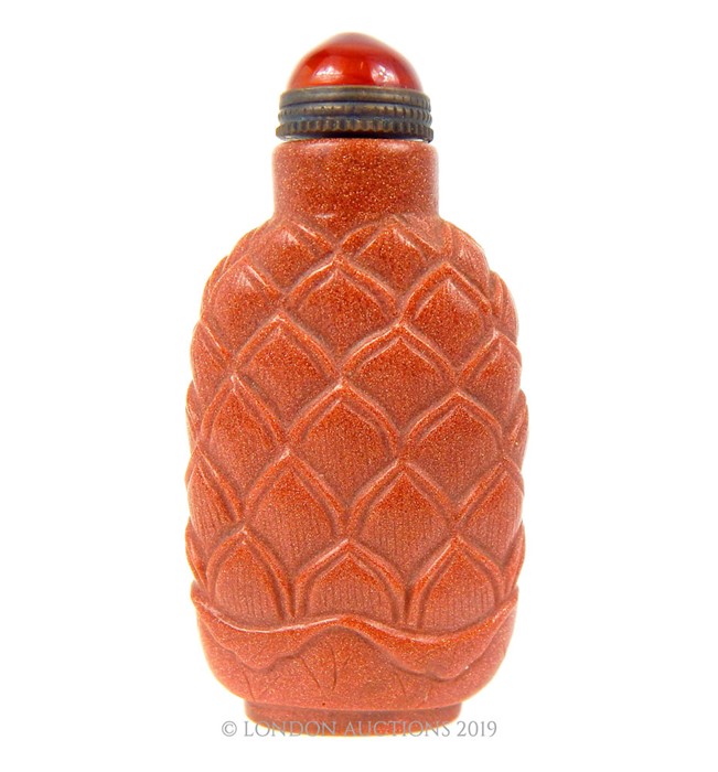 A Gold Stone Snuff Bottle.