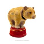 An Early To Mid Century Novelty Metal And Fabric Covered Bobble Head Bear