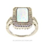 A Silver Cubic Zirconia Opal Panelled Ring.