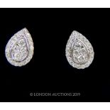 A pair Of 18 carat White Gold pear Shaped Diamond Earrings.