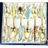A vintage cased set of six sterling silver and enamel coffee spoons. W: 42.3 grams. plus cased set
