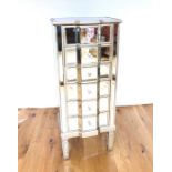 Mirrored Tallboy Raised On Four Legs With Six Drawers.