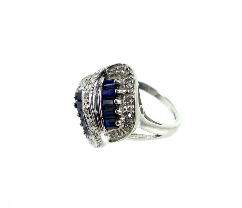 A Vintage 9 Carat White Gold Sapphire And Diamond Ring.