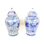 A Pair Of Large c1900 Blue And White Jars With Flowing Design